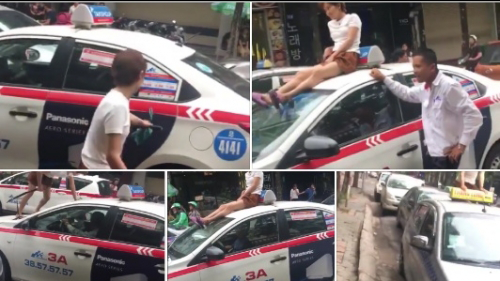 Cô gái 'ngáo đá' chặn đầu taxi, ung dung ngồi trên nóc xe